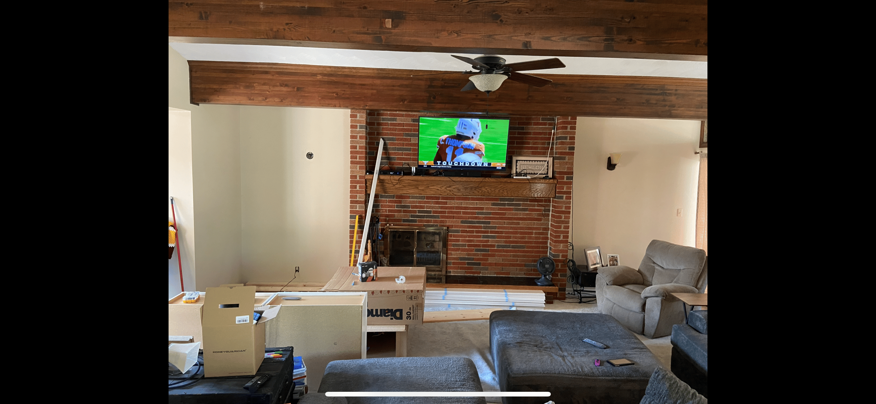 Family room before renovation with old carpet and dated wall colors